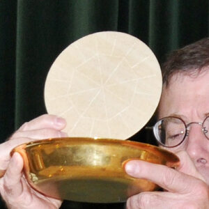 Eucharistic Host Lifted by Priest, adapted from .mil image