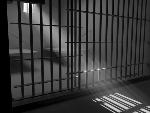 Dimly Lit Jail Cell with Bars, with Sunbeam Angling From Window, adapted from fbi.gov image