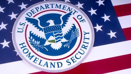 File photo of DHS logo and U.S. Flag adapted from .gov image