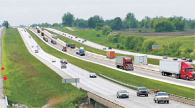 File photo of highway with traffic, adapted from dot.gov photo