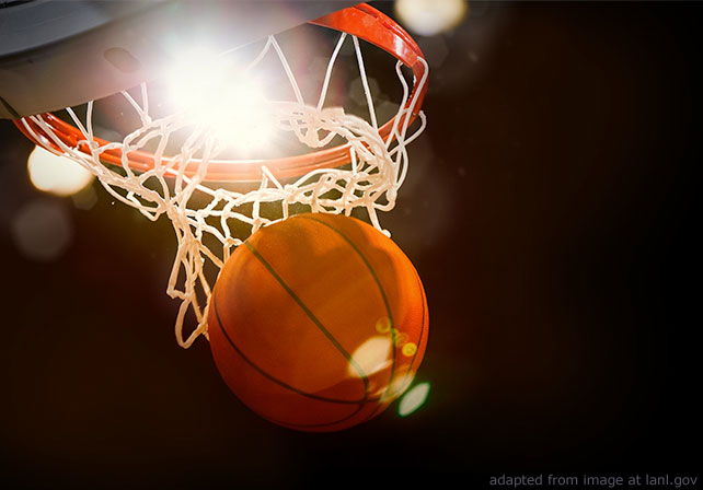 Basketball going through hoop and net against bright light, adapted from lanl.gov image