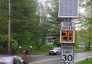 Speed Limit Sign, Your Speed Sign with Automated Speed Reading, in Leafy Neighborhood, adapted from dot.gov image