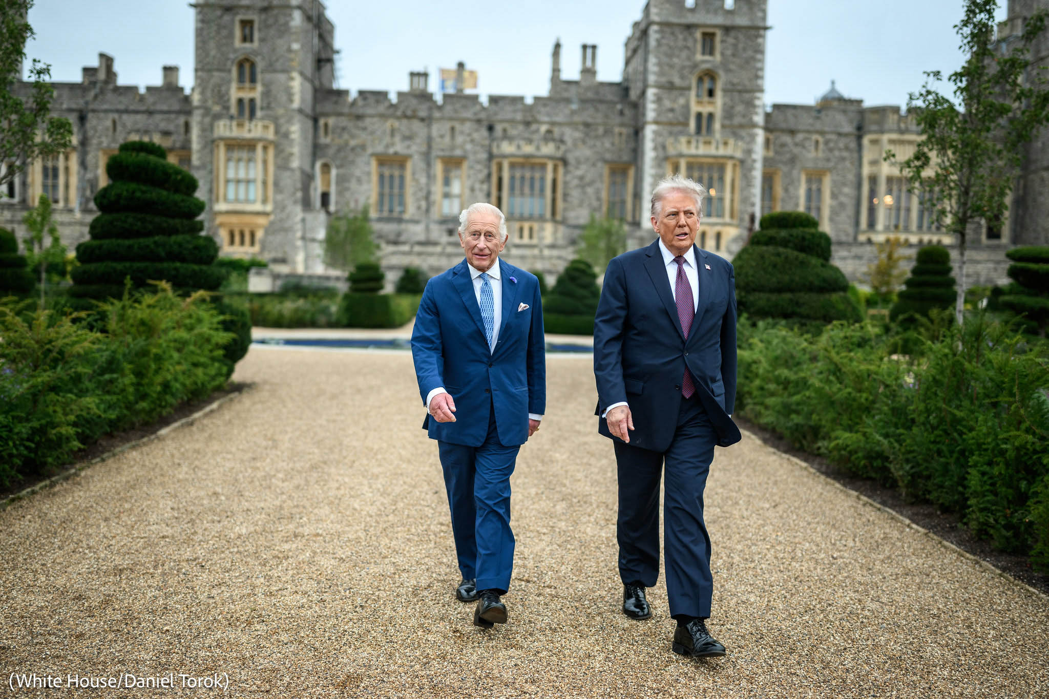 King Charles and Donald Trump Walking in front of Windsor Castle, with photo credit to White House / Daniel Torok, adapted from whitehouse.gov image