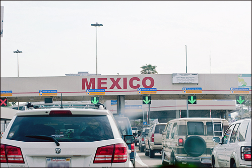 Cars at Border Checkpoint with Mexico Sign adapted from fbi.gov image