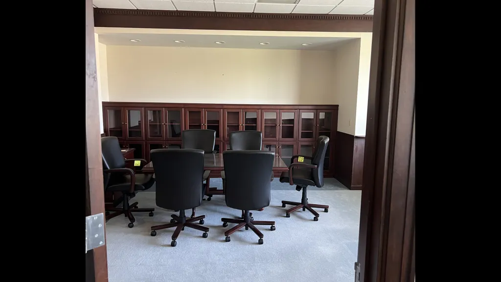 Empty room with chairs, table, cabinet, adapted from nasa.gov image