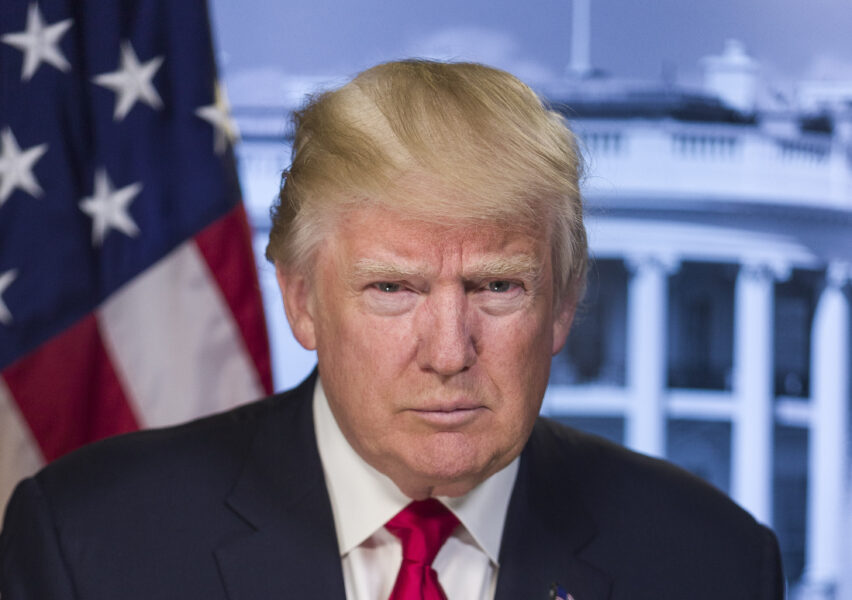 File Photo of Donald Trump Scowling, with White House and U.S. Flag in the Background, adapted from usembassy.gov image