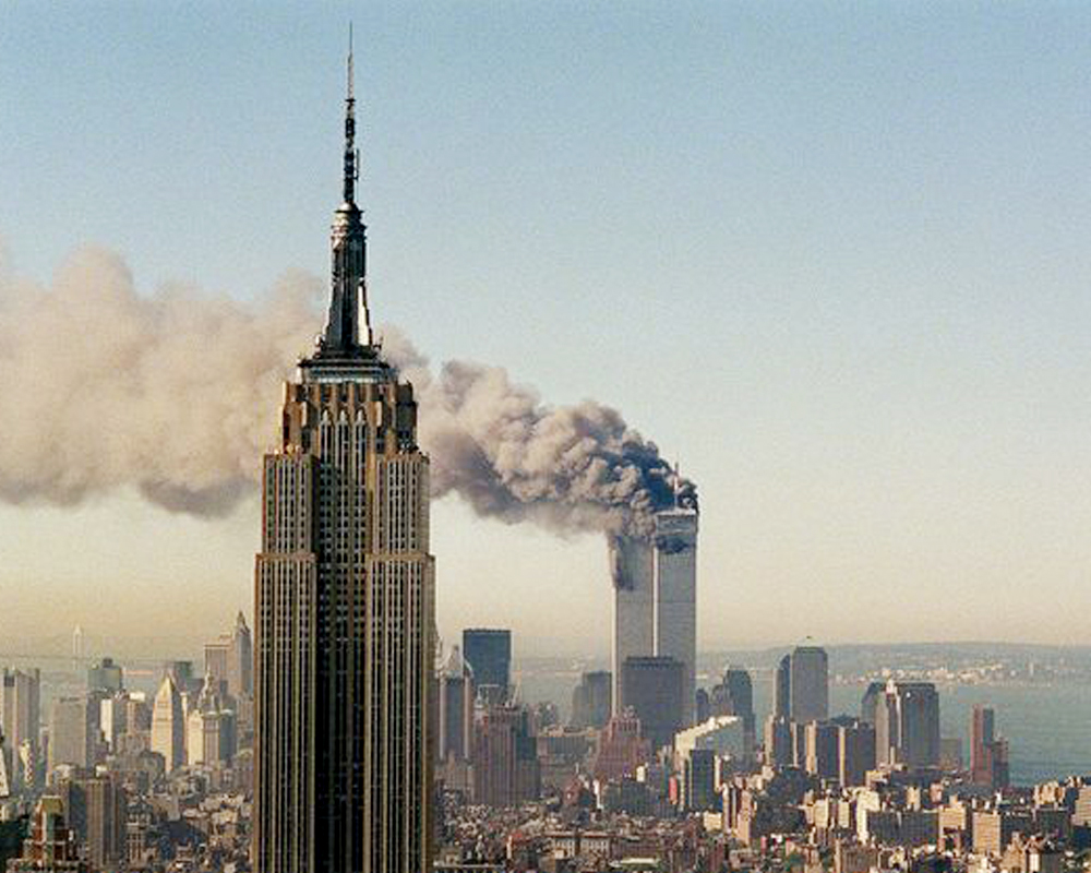 Empire State Building and World Trade Center Towers Billowing Smoke and Fire on 9/11, adapted from defense.gov image